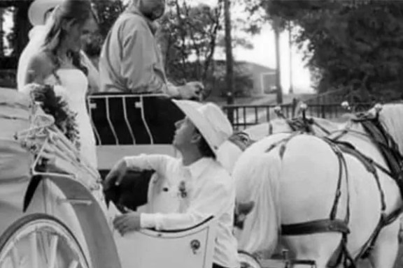 a group of people riding on the back of a horse drawn carriage