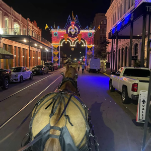 a person walking down a street next to a building